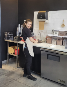 CFCC Bridge to Independence student works in a commercial kitchen.