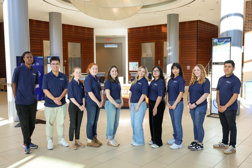 student ambassadors in front of information desk
