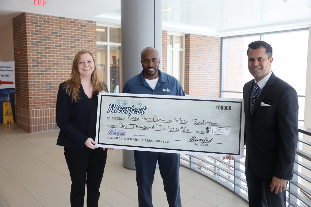 From left to right are Breana Hebert, CFCC Director of Advancement; Roderick Bell, President of Wilmington Riverfest; Shane Fernando, CFCC VP of Advancement & the Arts