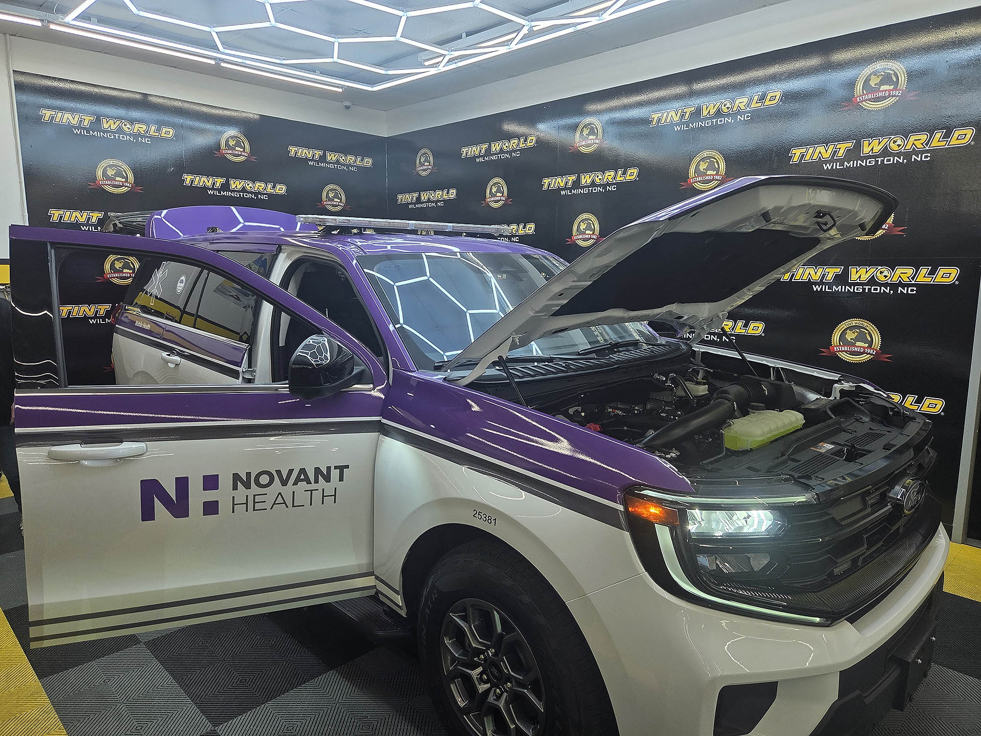 Automotive Window Tint & Vinyl Wrap Example Novant Health wrapped SUV with emergency lighting.