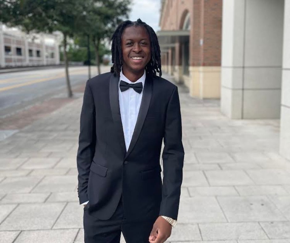 Marcus in suit in front of Union station