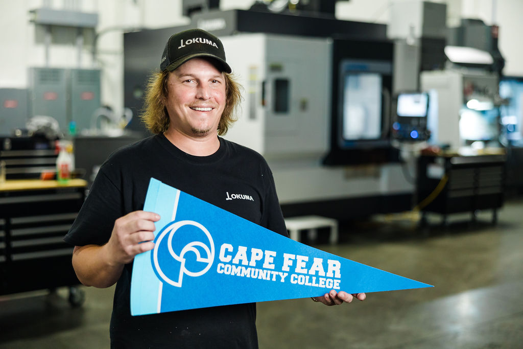 employer holding cfcc sign