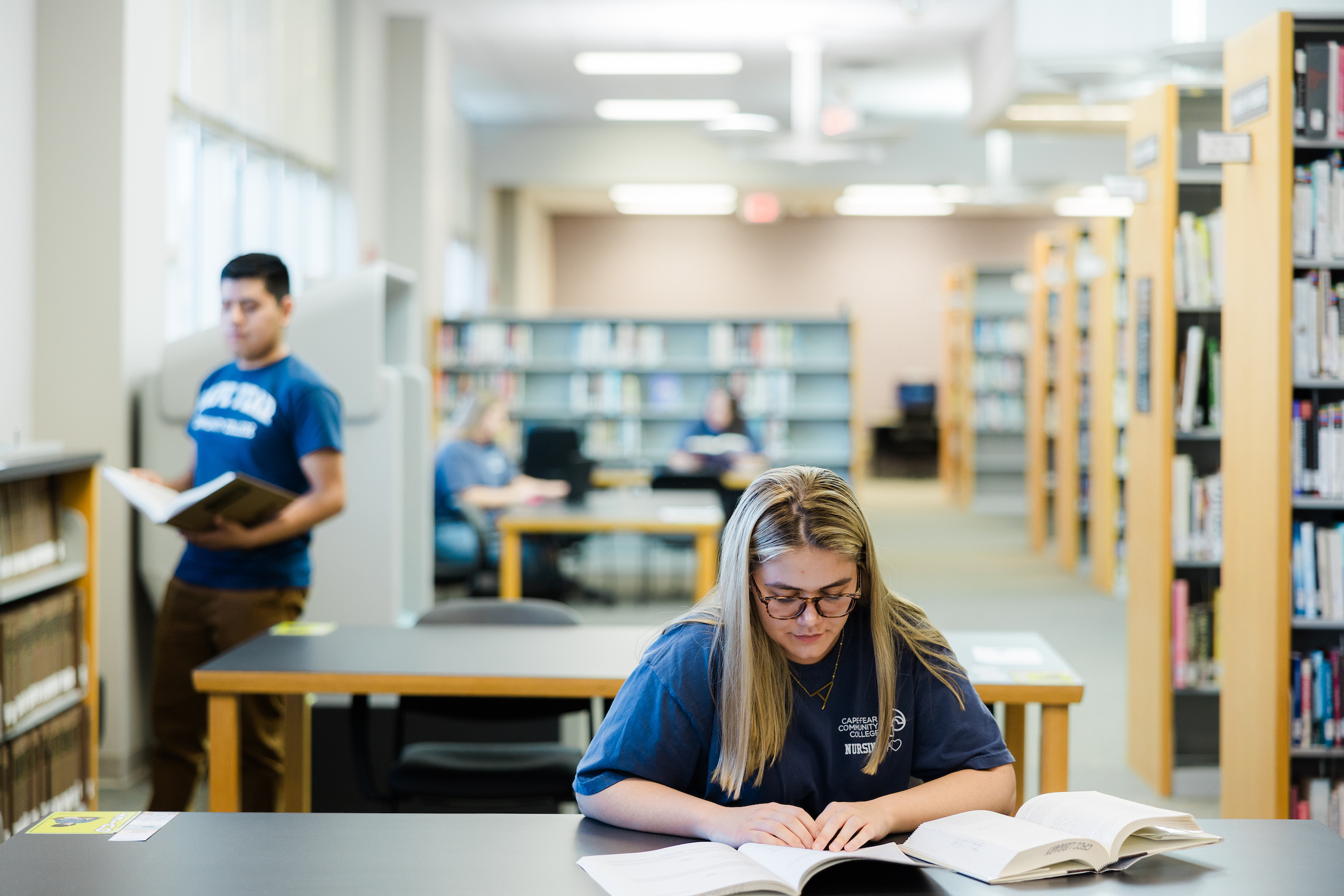 students reading books in library