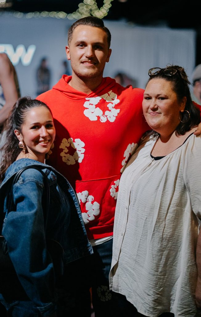 Image of three people, a young female, a male, and their mother.