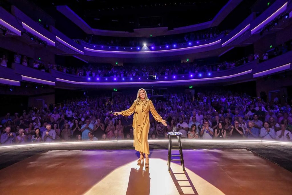 Comedian Leanne Morgan stands on stage at CFCC's Wilson Center in front of a sold out crowd for the Netflix taping of her comedy special in June 2025.