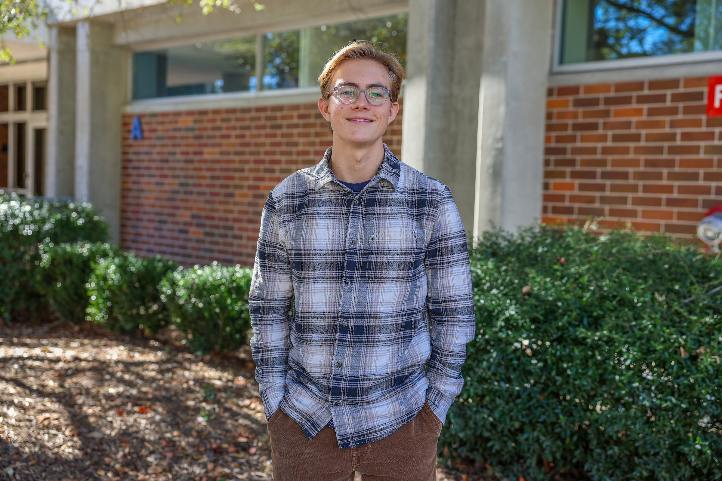 miles moore stands in front of cfcc building
