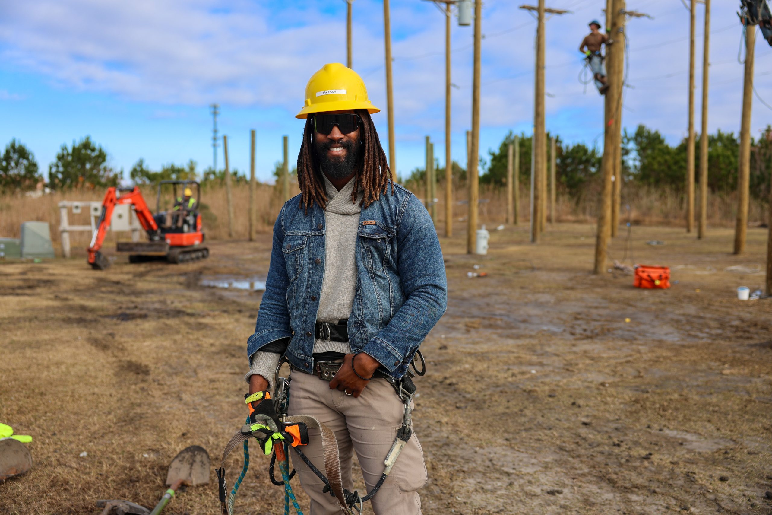 male lineworker in poleyard
