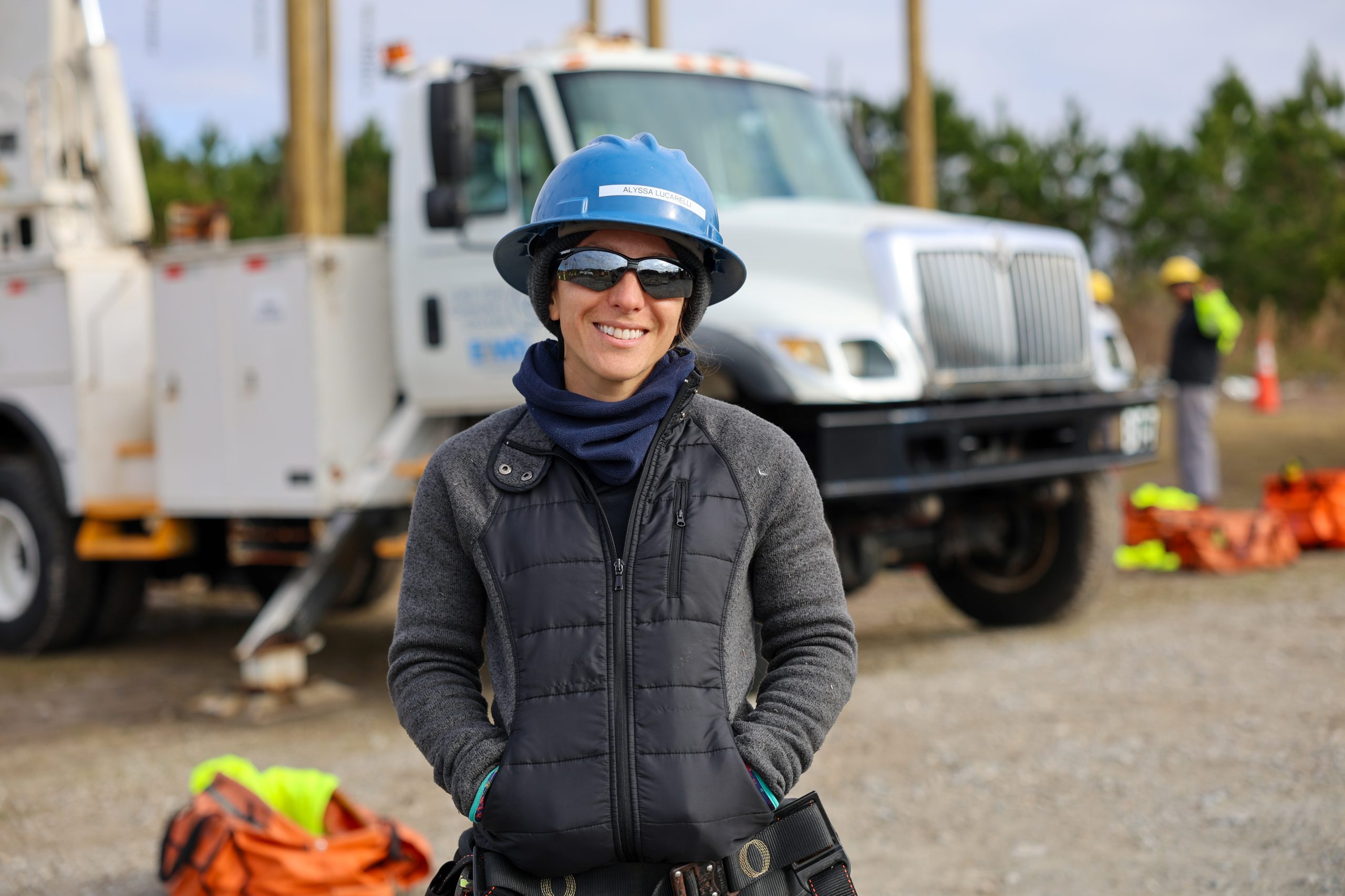 female lineworker at poleyard