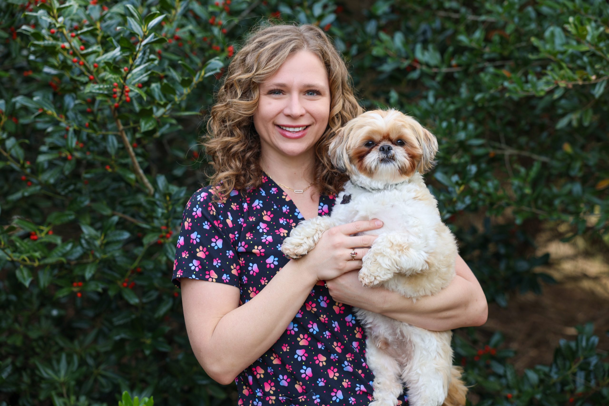 Female holding her dog