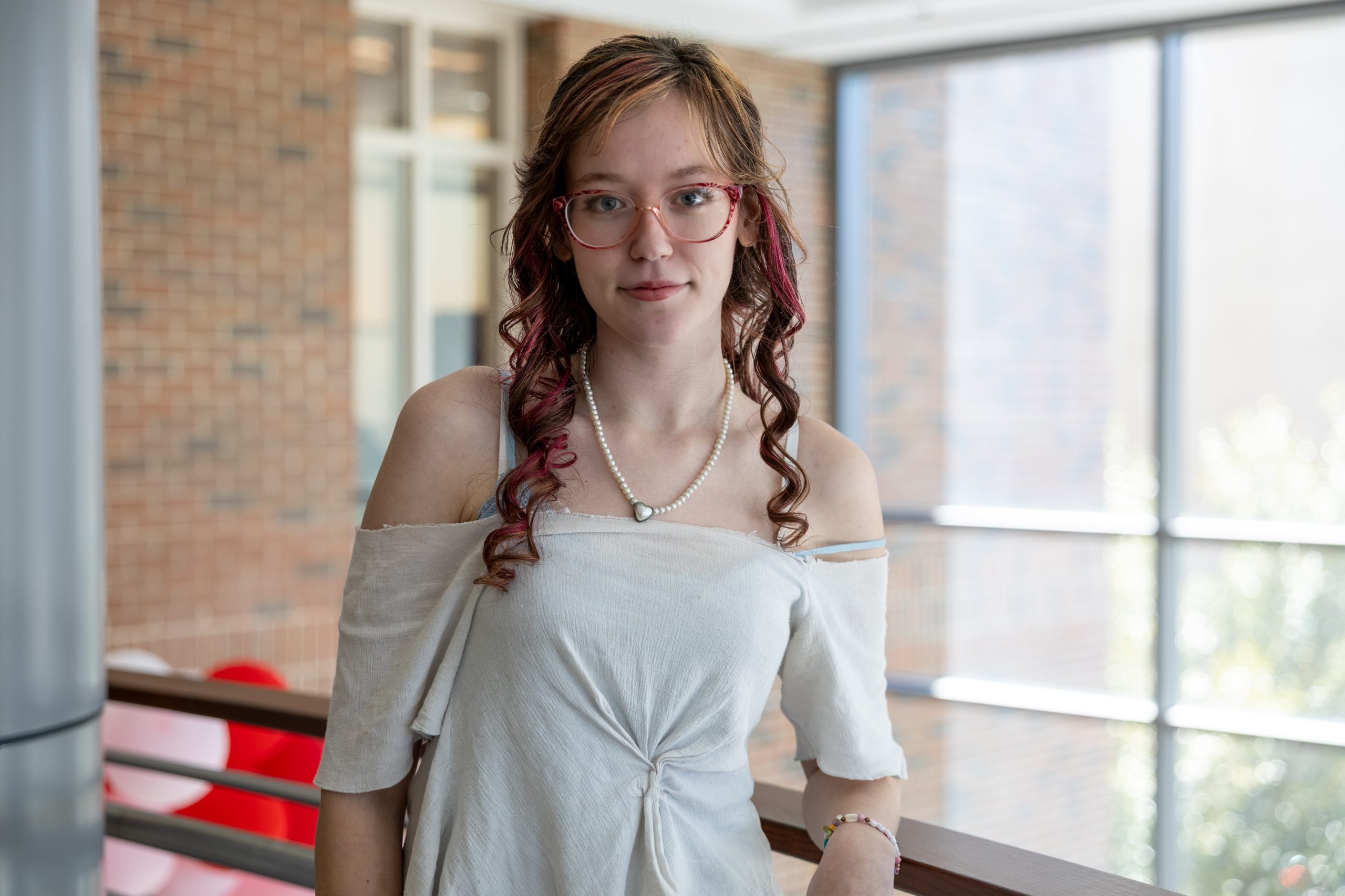Female headshot in college building