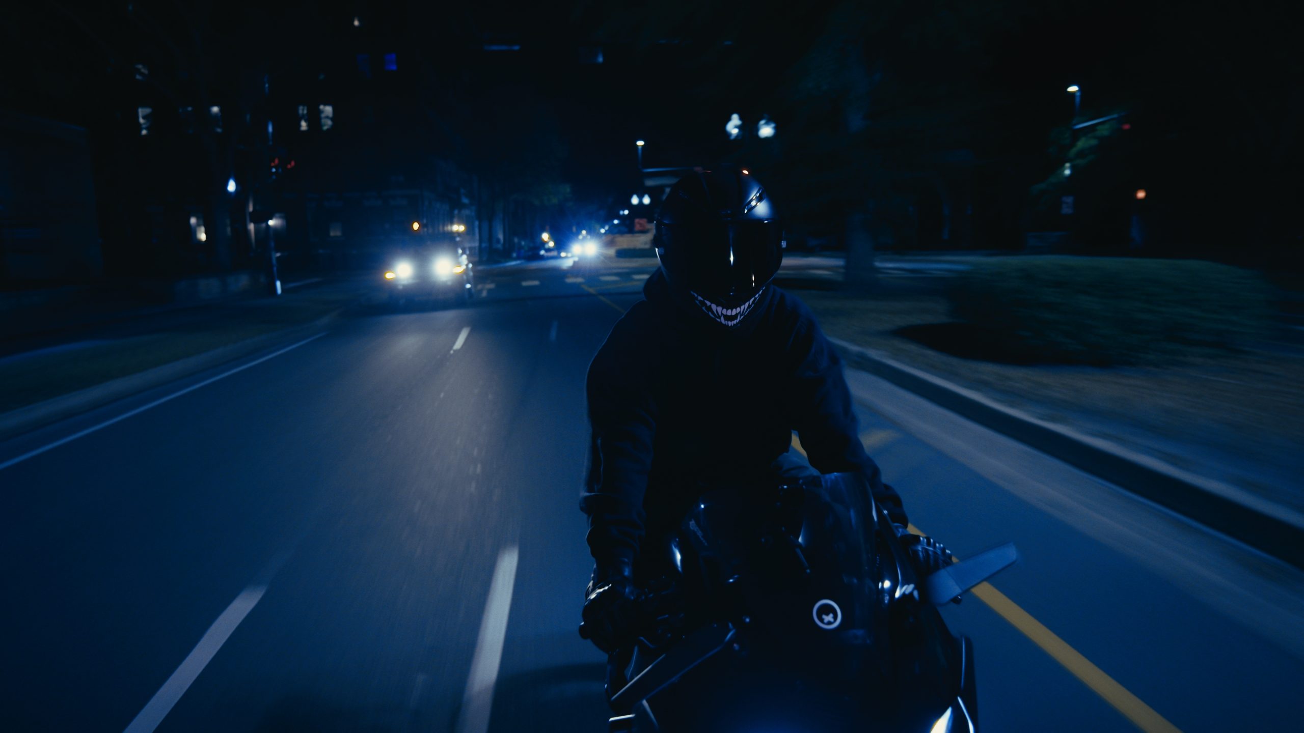 person riding motorcycle at night