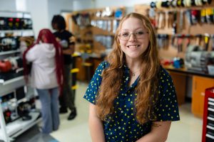 Mechatronics student smiling.