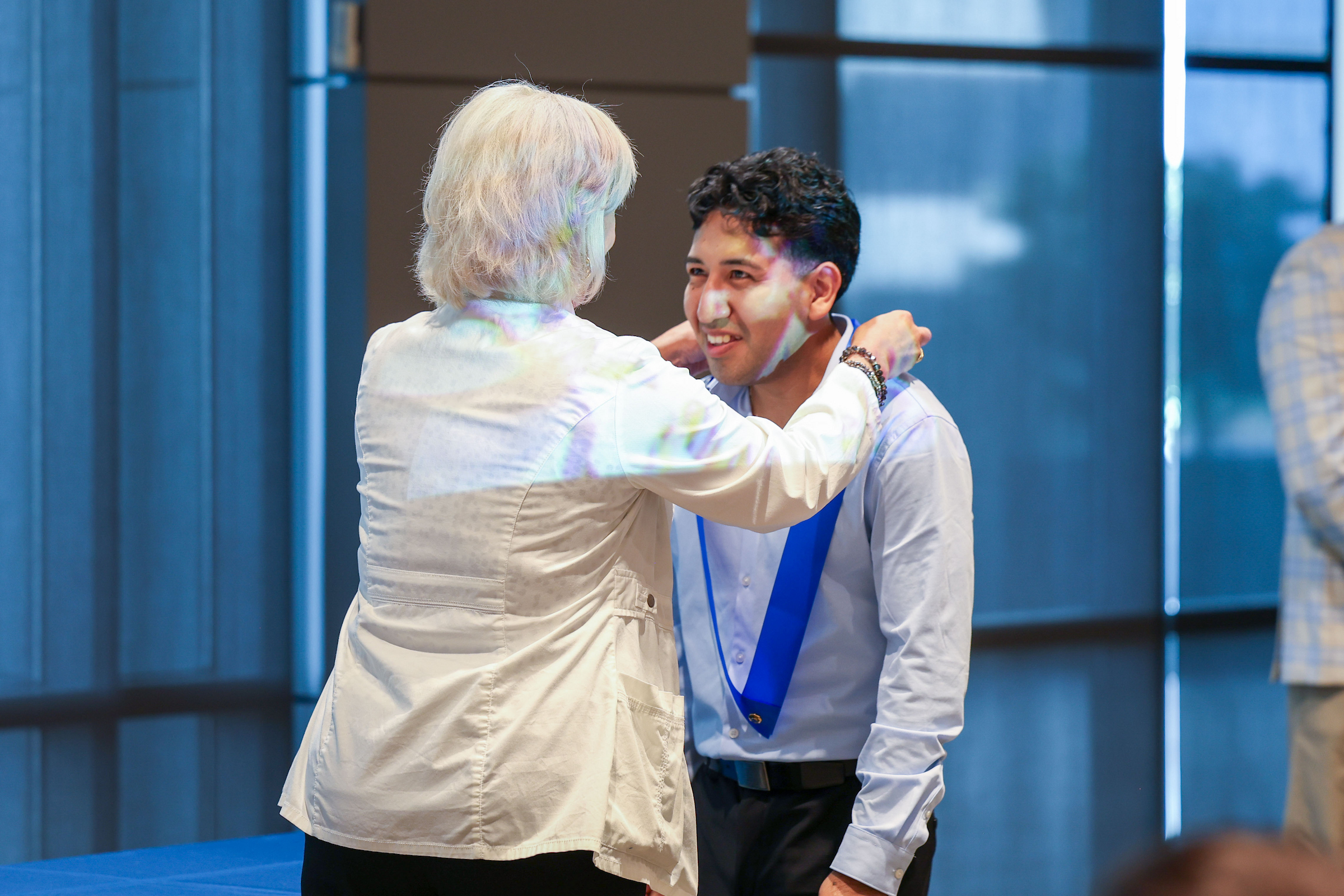 student getting pinned during ceremony