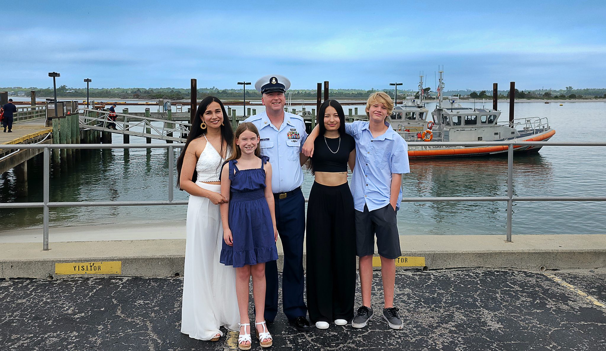 group of family members outside on pier
