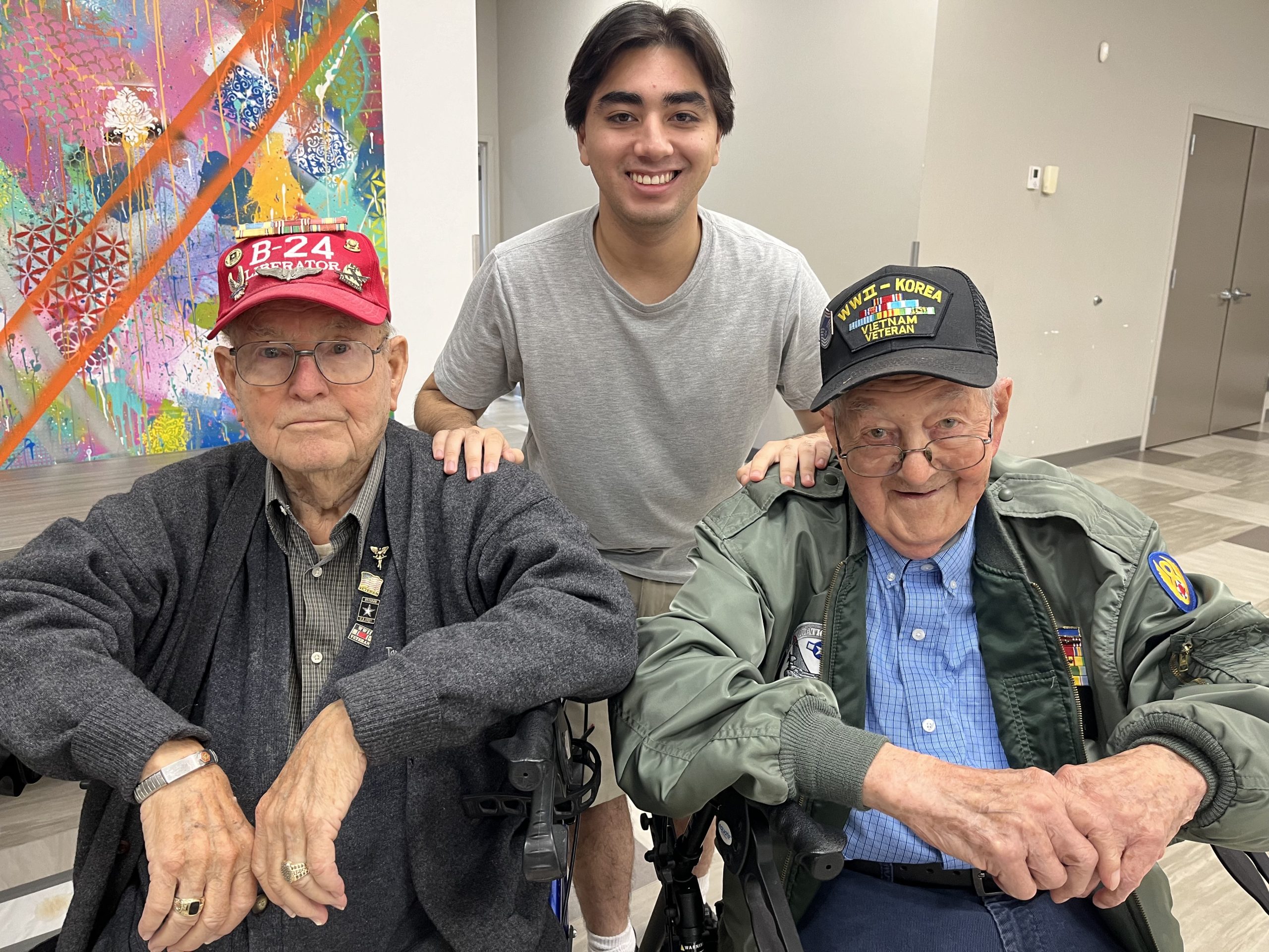 luke standing behind two veterans