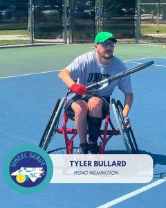 man in wheelchair playing tennis