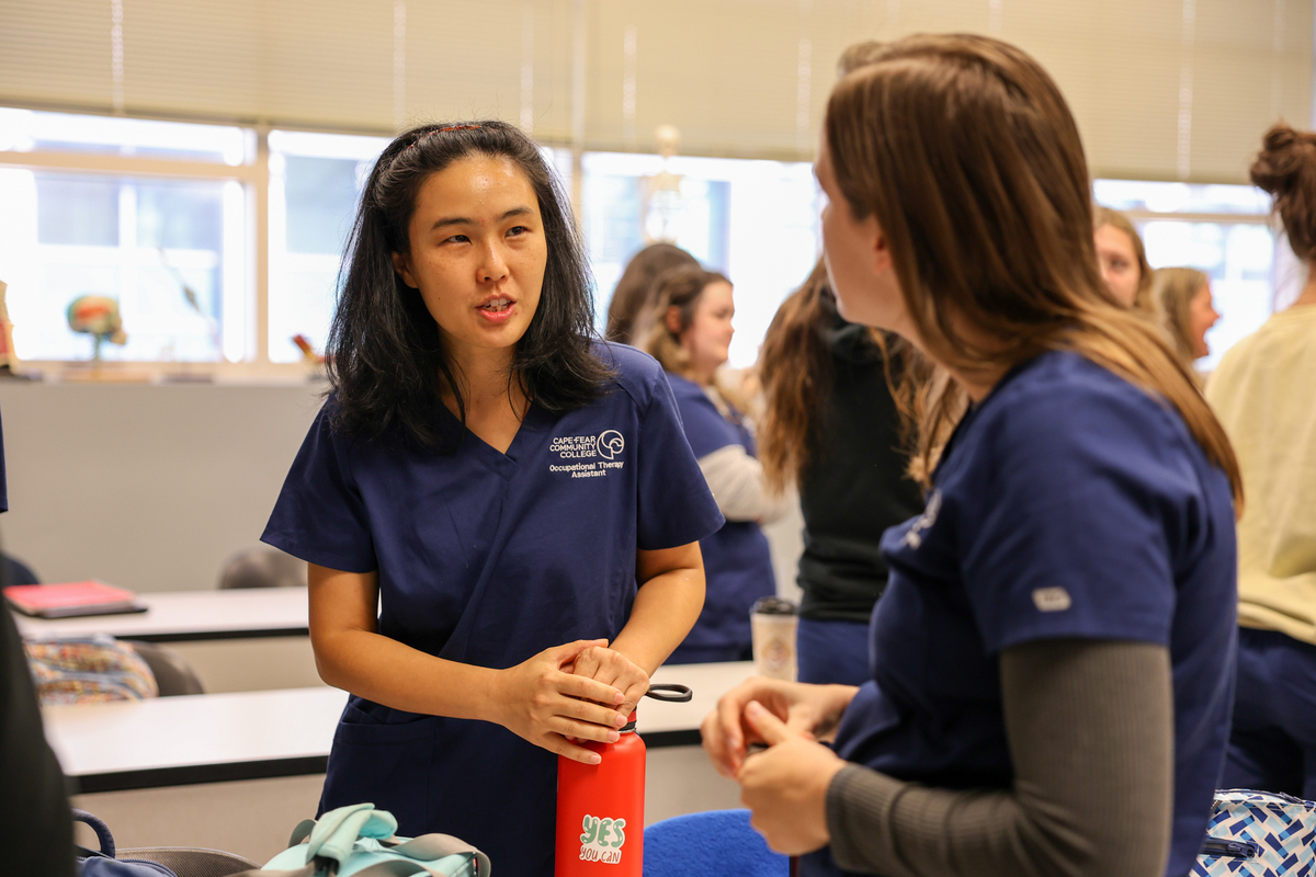 two healthcare students talking to each other