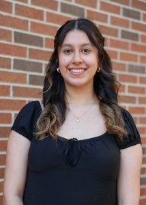 student headshot in front of brick wall