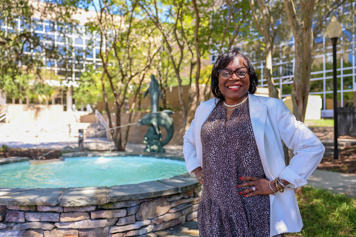 woman standing near fountain outside