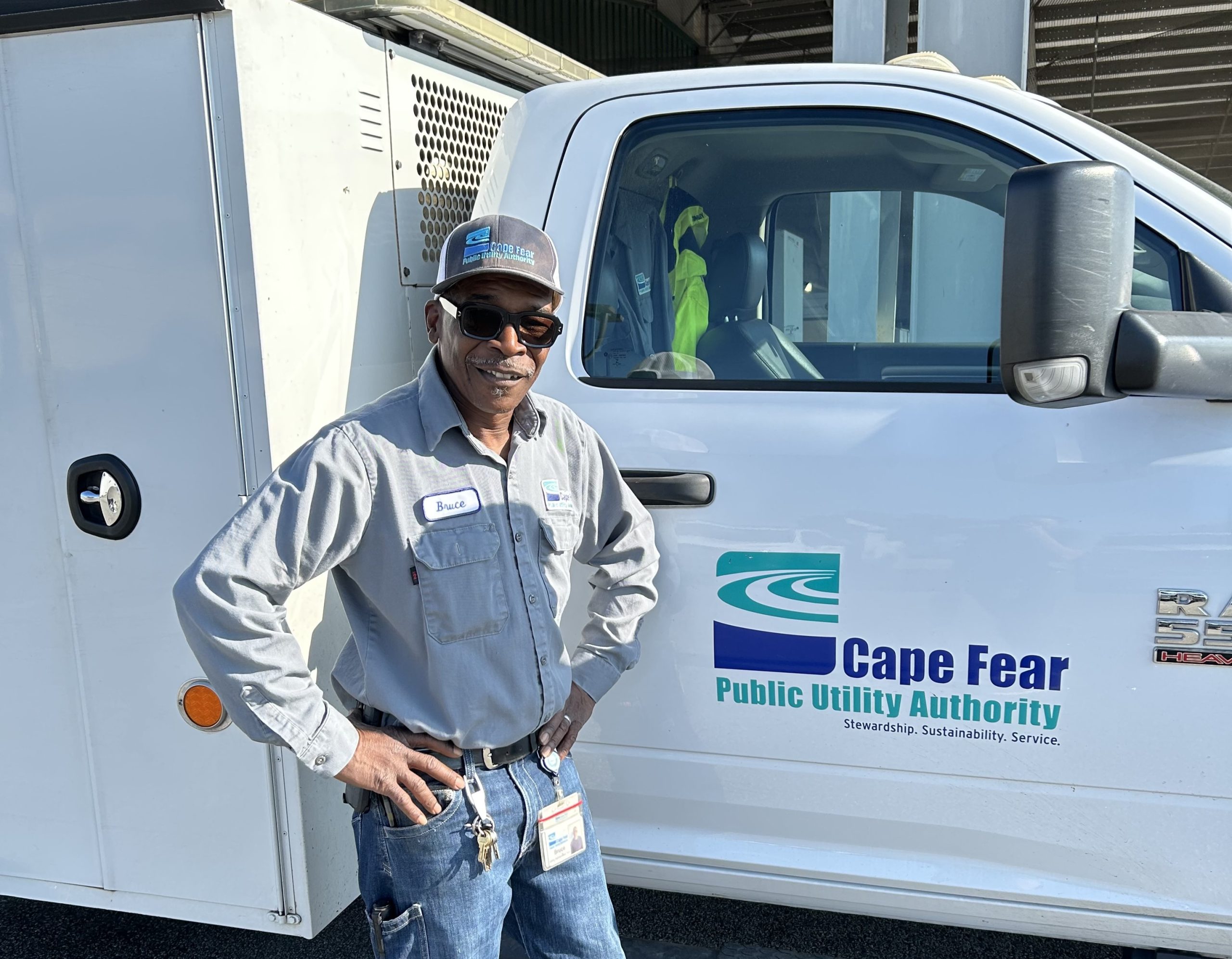 utility man standing in front of truck