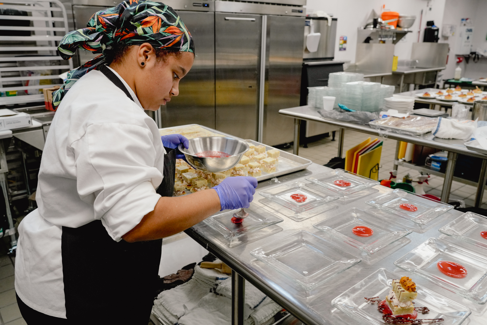 student preparing dishes in kitchen