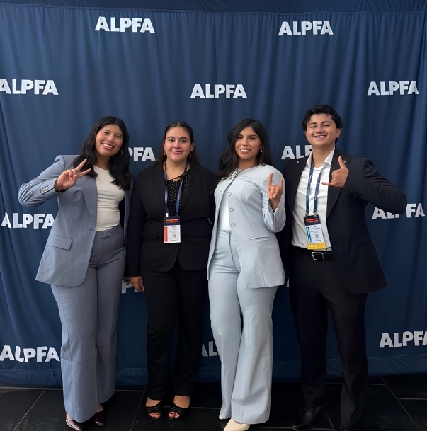 students behind ALPFA backdrop