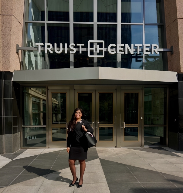 student stands outside Truist bank